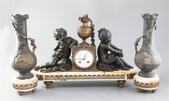 A French Art Nouveau bronzed spelter and marble three piece clock garniture, clock 20in.